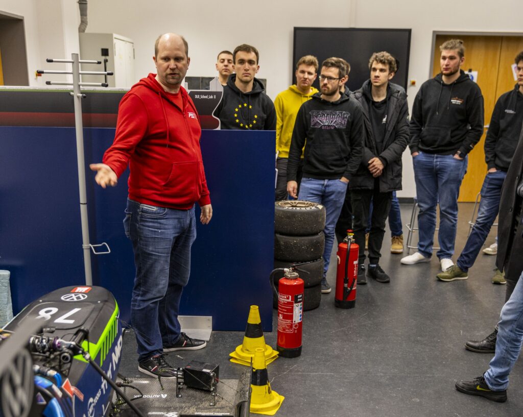 Group of students and a trainer at the training for electrical system officers